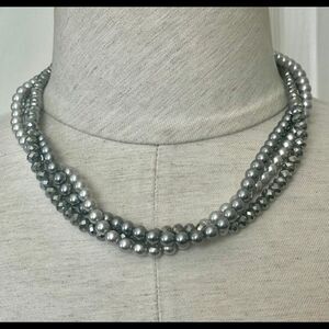 The Roman company Tri strand gray necklace